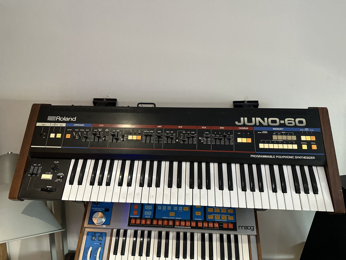 A Roland Juno-60 analogue polysynth, sliders and chorus switches across the front panel