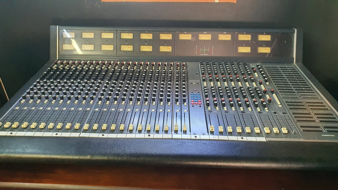 A restored Soundtracs CMX4400 analogue console, sixteen VU meters across the bridge and the routing matrix at the right