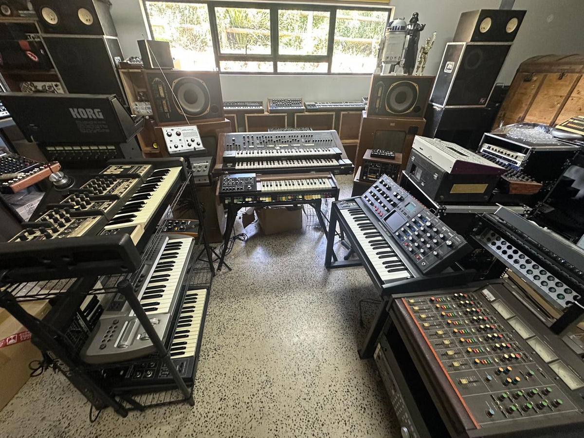 The Inner Pieces synth room: Korg, Hammond, Roland and Akai keyboards stacked around a vintage mixing desk